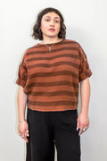 Curator Izzy Top
